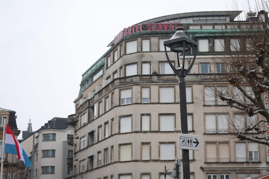 Curved building with windows and a street lamp